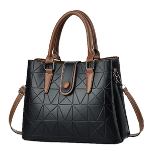 Black geometric embossed tote bag with brown handles and shoulder strap for office