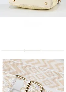 Detail of woven handbag base with gold feet and geometric patterned wide strap