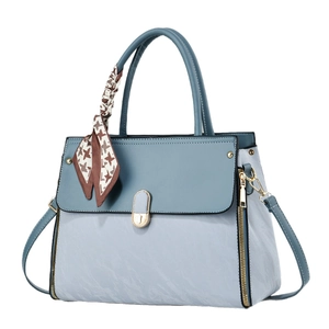 Sac à main bicolore en cuir avec boucle dorée et poignée ornée d'un foulard chic