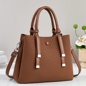 Large brown woven texture tote bag with top handles and adjustable shoulder strap for women