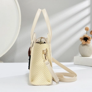 Detail of woven texture and adjustable shoulder strap on large tote bag