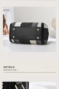 Detail of woven Boston bag base with black leather material and gold protective metal studs