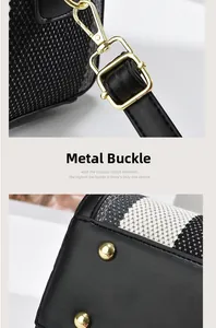 Detail of premium golden metal buckles and protective studs on a stylish tote bag
