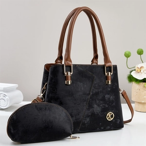 Elegant black velvet tote bag and pouch set with brown handles and golden K logo charm