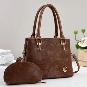Detail of a brown textured faux leather handbag set with gold K logo and mini coin purse