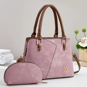 Detail of mauve leather handbag set with gold K logo and matching zipper pouch