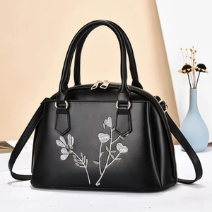Elegante schwarze Handtasche mit silberner Blumenstickerei und Goldbeschlägen