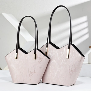 Pink marble pattern leather tote bag set with black handles and gold hardware