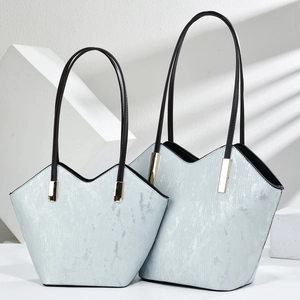 Modern light blue retro oil leather tote bags with structured V-cut and slim straps