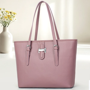 Detail of lavender lychee leather tote bag with silver metal hardware and buckle