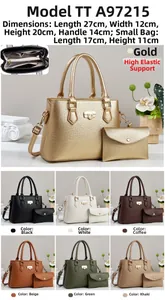 Detail view of two-piece handbag set featuring trapezoidal bag and envelope pouch