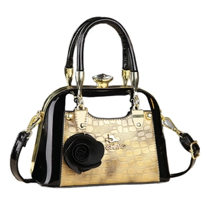 Mini shell-shaped crossbody bag for women in vintage black and gold textured finish