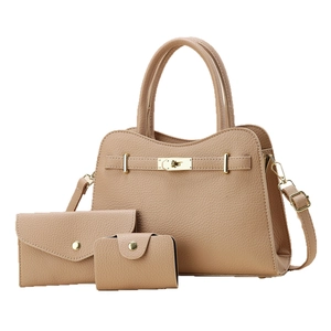 Three-piece vintage pebble leather handbag set with shoulder strap and golden twist lock