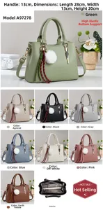 Detail view of large lychee texture handbag showing multiple colors and interior structure