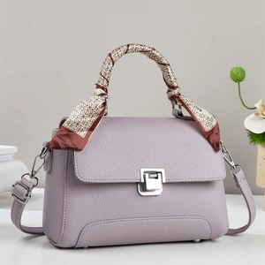 Lavender lychee pattern handbag with silver lock and decorative silk scarf handle