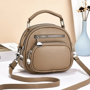 Vintage brown pebbled leather crossbody bag with multiple zip compartments and top handle