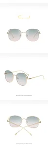 Detail of vintage oversized sunglasses with metal cutout frame and green purple gradient lens