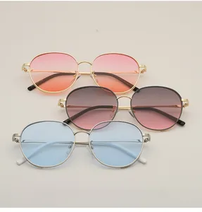 Detailed stack of vintage round metal sunglasses with colorful gradient lenses in three shades