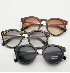 Retro oval sunglasses in tortoiseshell, brown, and black with UV400 protection lenses