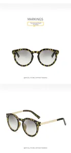Detail of tortoiseshell sunglasses with UV400 protection and golden metal temples