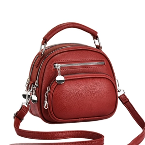 Red triple-zipper crossbody phone bag in pebble-grain leather with silver hardware