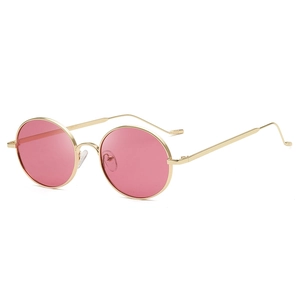 Eleganti occhiali da sole ovali rosa con montatura in metallo dorato vista laterale