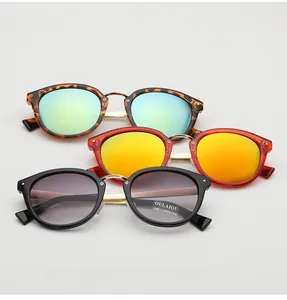 Close-up of stylish UV400 sunglasses in tortoise, red, and black jelly frames with metal bridge