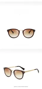 Detail view of vintage Phantos sunglasses with brown gradient lenses and gold metal accents