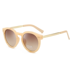 Retro oval sunglasses with beige marble frames and gold metal legs from a 45-degree angle