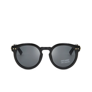 Retro oval black sunglasses with gold rivets and UV400 lenses in a stylish oversized frame