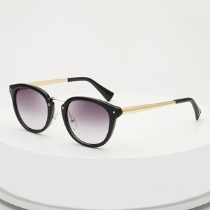 Retro black round sunglasses with purple gradient lenses and gold metal temples