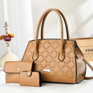 Three-piece set of brown faux leather handbags featuring geometric quilted texture design