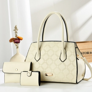 Detailed macro view of a 3-piece beige tote bag set with textured geometric patterns