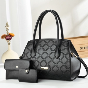 Detailed view of 3-piece black textured leather handbag set with golden hardware accents