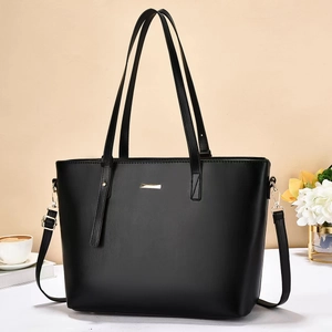 Classic black PU leather tote bag with gold hardware and adjustable shoulder strap