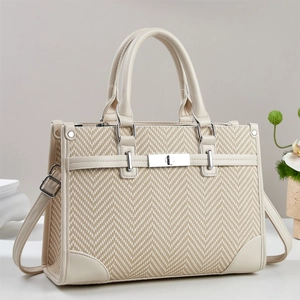 Elegant beige herringbone weave handbag with smooth leather trim and silver metal buckle lock