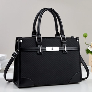 Chic black herringbone tote bag with adjustable strap and silver turn-lock for women