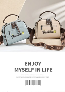 Close-up of minimalist handbag showing floral straps and Fashion text in blue and beige