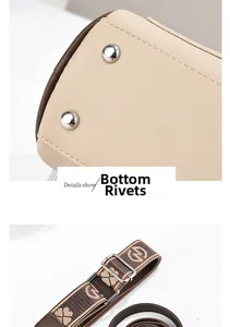 Detail of protective metal rivets on leather base and jacquard floral pattern strap