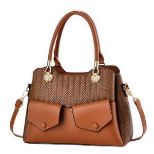 Brown textured woven tote bag with smooth faux leather details and gold hardware