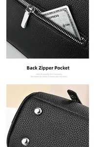 Detail of black pebbled leather bag with back zipper pocket and silver metal bottom studs