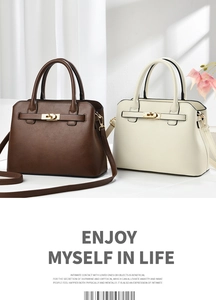 Detail of elegant handbags with gold hardware locks and adjustable shoulder straps