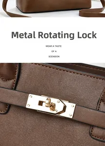Detail of the golden twist lock hardware on brown lychee grain leather handbag