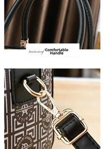 Detailsicht der bequemen Griffe und goldenen Metallbeschläge der Boston-Handtasche