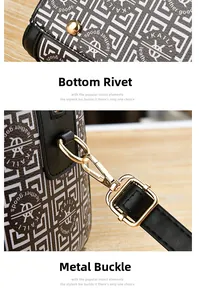 Detail of golden metal protective studs on the base and detachable strap hooks on the bag