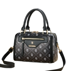 Chic black and white Boston satchel with monogram print and crossbody strap
