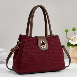 Luxury burgundy woven tote bag with gold droplet twist lock and brown leather handles