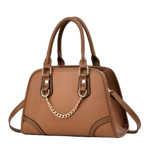 Elegant brown pebbled leather handbag for women featuring gold chain and hardware