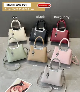 Selection of seven textured lychee pattern handbags in assorted colors with metal charms