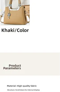 Detail of khaki leather handbag with silver handle and leaf-shaped rhinestone pendant